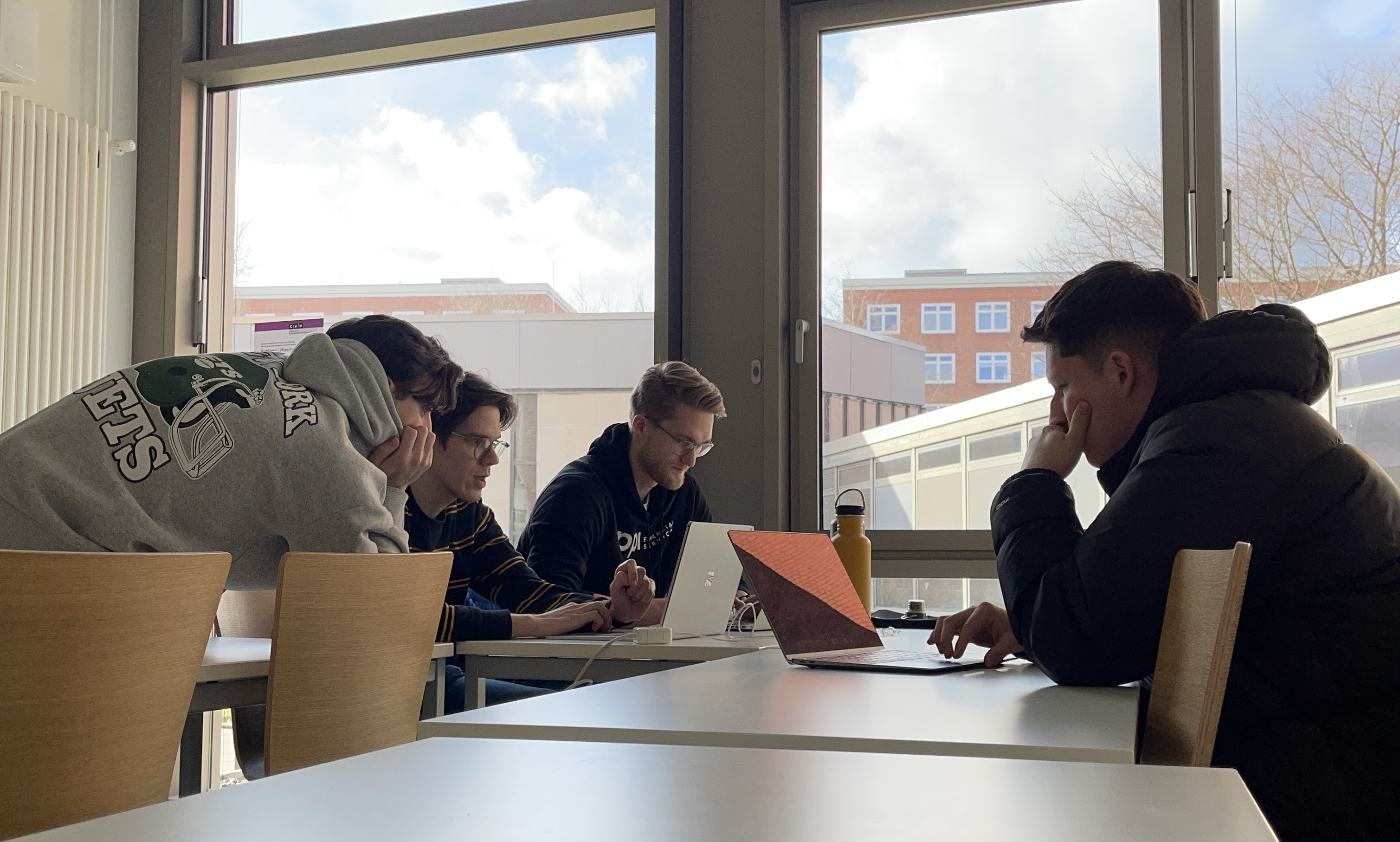 All four group members working together at the project.